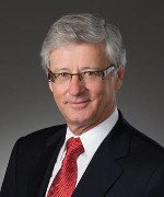Professional photograph of Commission chair Guy Bujold