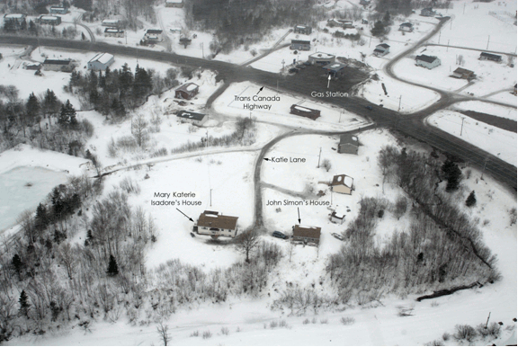 Aerial photograph of the area surrounding John Simon's residence. The photo visually demonstrates the location of Mary Katherie Isadore's house and John Simon's house on Katie Lane and their proximity to the Trans-Canada Highway and the gas station.